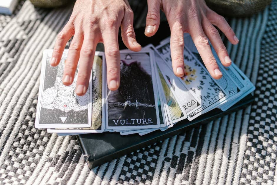 Woman with hands over a tarot deck